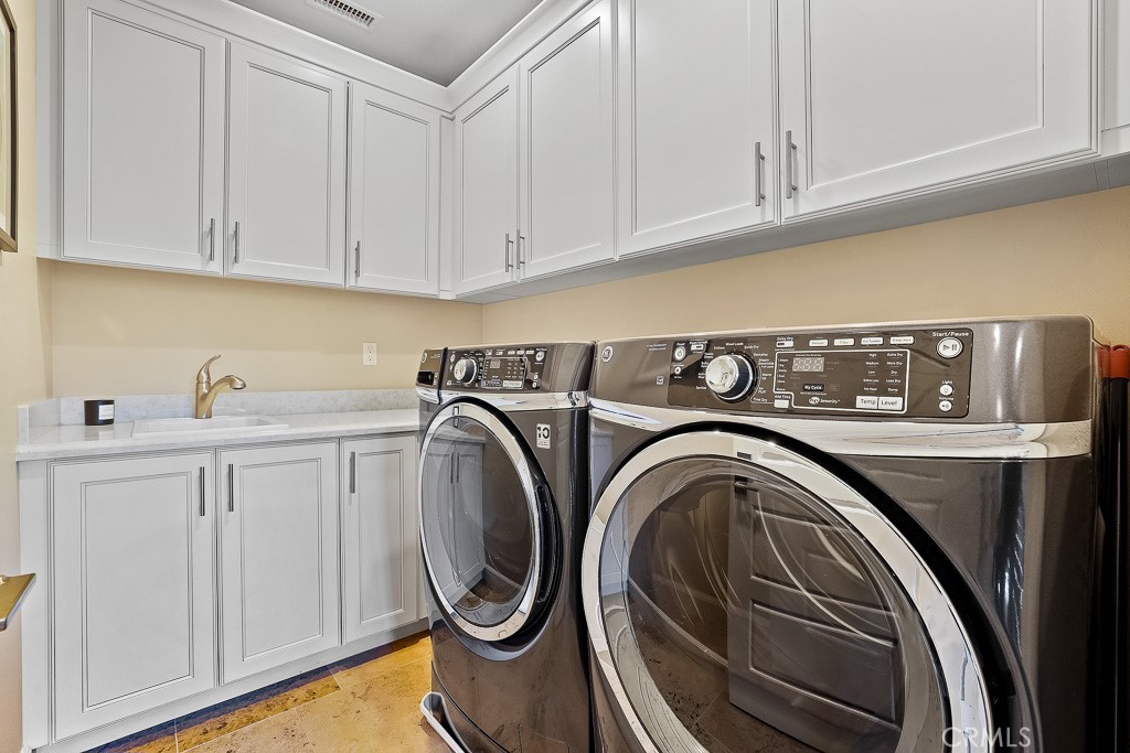 89 Lavender Lake Forest, CA 92630 - Photo 29 of 45 a utility room with dryer and washer