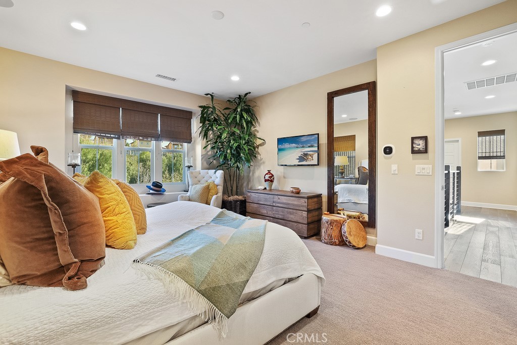 89 Lavender Lake Forest, CA 92630 - Photo 31 of 45 a bed room with a bed and a couch