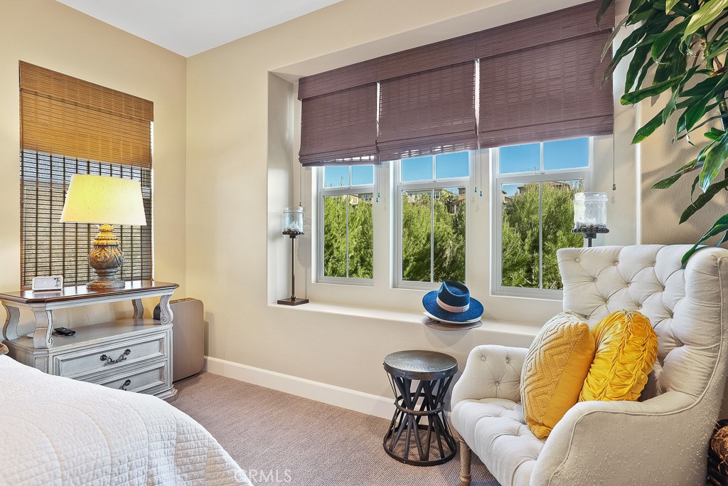89 Lavender Lake Forest, CA 92630 - Photo 32 of 45 a bedroom with furniture and a large window