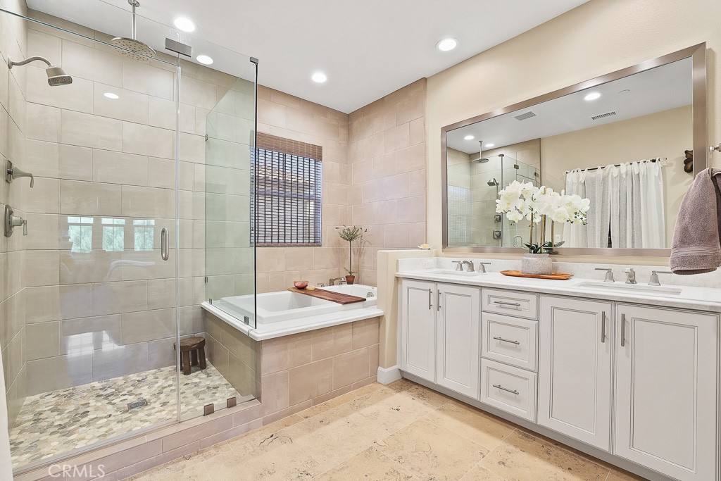 89 Lavender Lake Forest, CA 92630 - Photo 34 of 45 a bathroom with a sink double vanity granite tub shower and a mirror