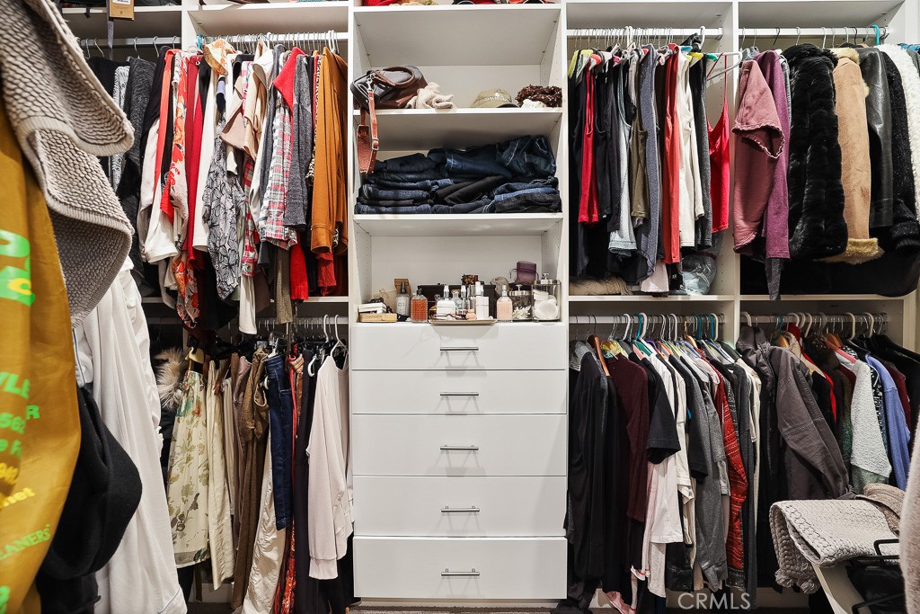89 Lavender Lake Forest, CA 92630 - Photo 36 of 45 a view of walk in closet with clothes