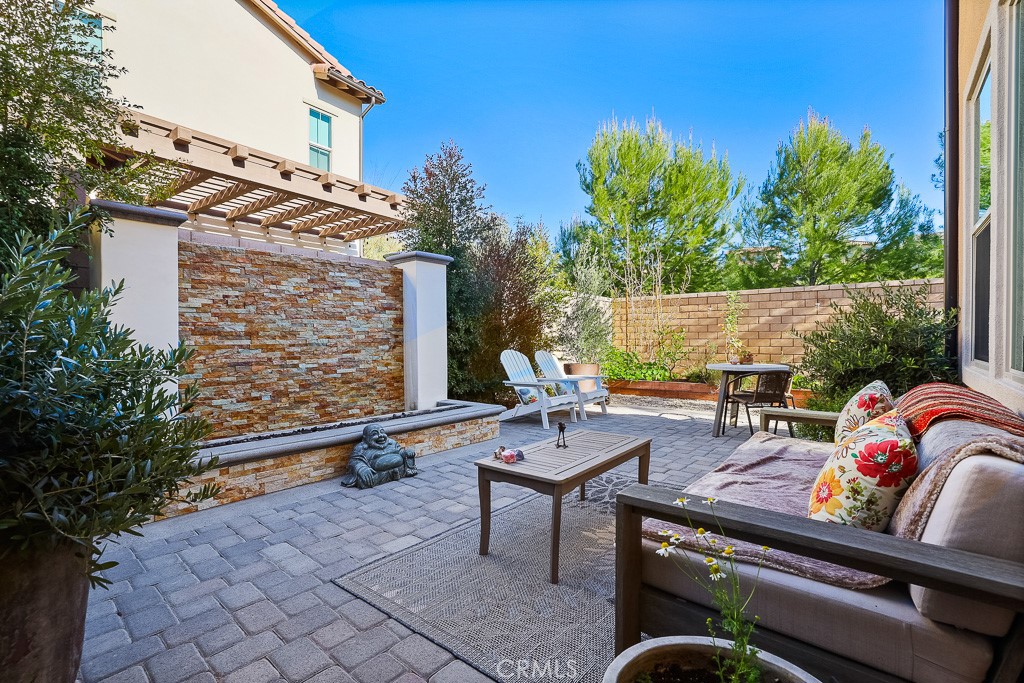 89 Lavender Lake Forest, CA 92630 - Photo 37 of 45 a view of backyard with seating space and trees in the background