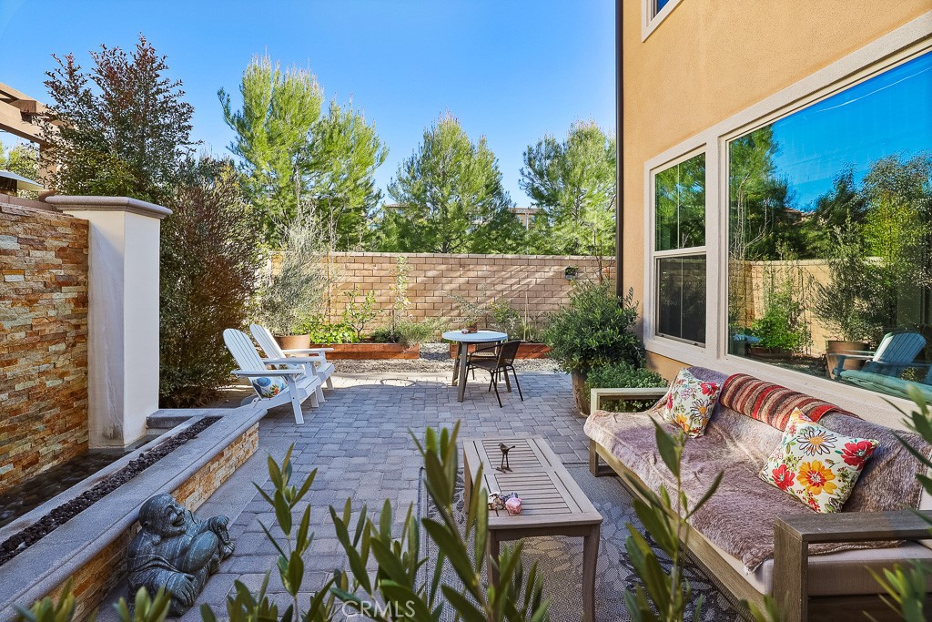 89 Lavender Lake Forest, CA 92630 - Photo 38 of 45 a view of a patio with table and chairs and potted plants