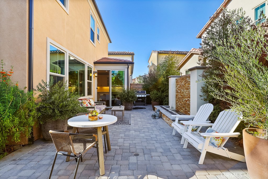 89 Lavender Lake Forest, CA 92630 - Photo 41 of 45 a view of a patio with a table and chairs in a patio