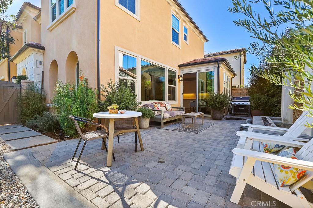 89 Lavender Lake Forest, CA 92630 - Photo 42 of 45 a view of a patio with couches table and chairs and potted plants