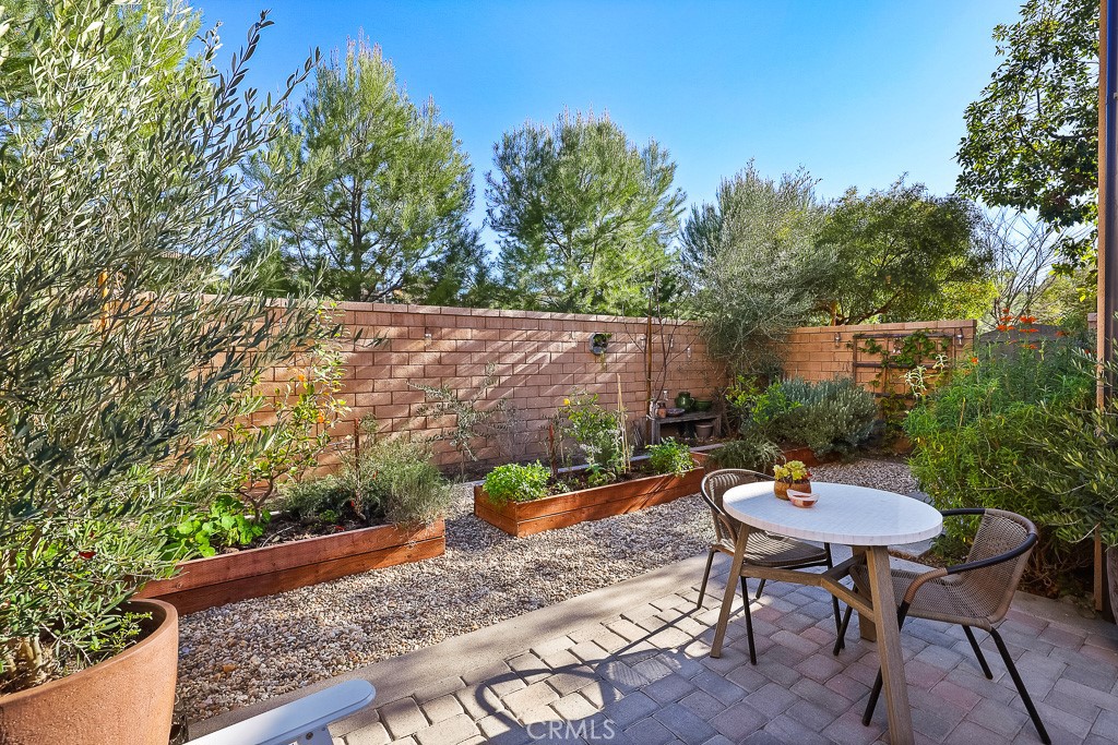 89 Lavender Lake Forest, CA 92630 - Photo 43 of 45 a backyard of a house with a table and chairs