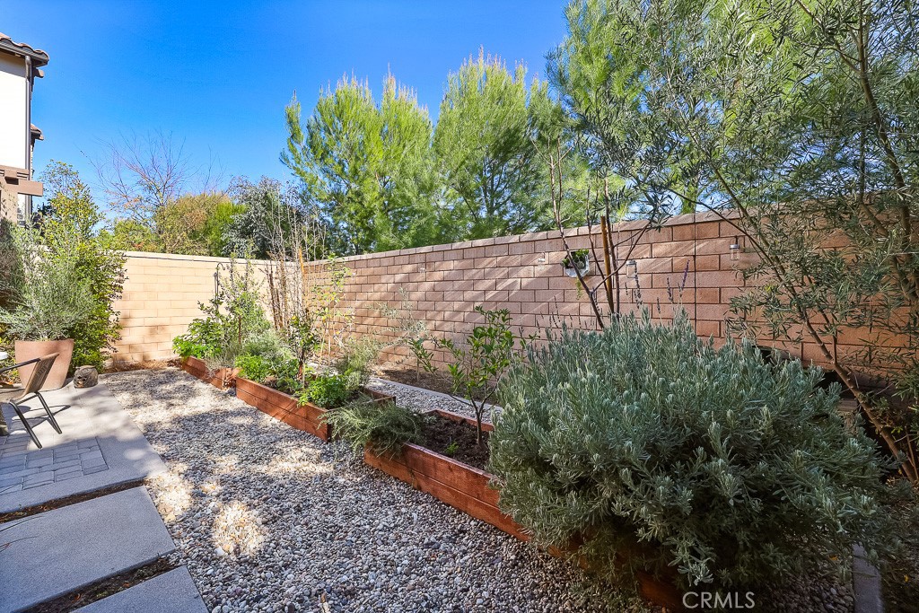 89 Lavender Lake Forest, CA 92630 - Photo 44 of 45 a view of a yard with plants and wooden fence