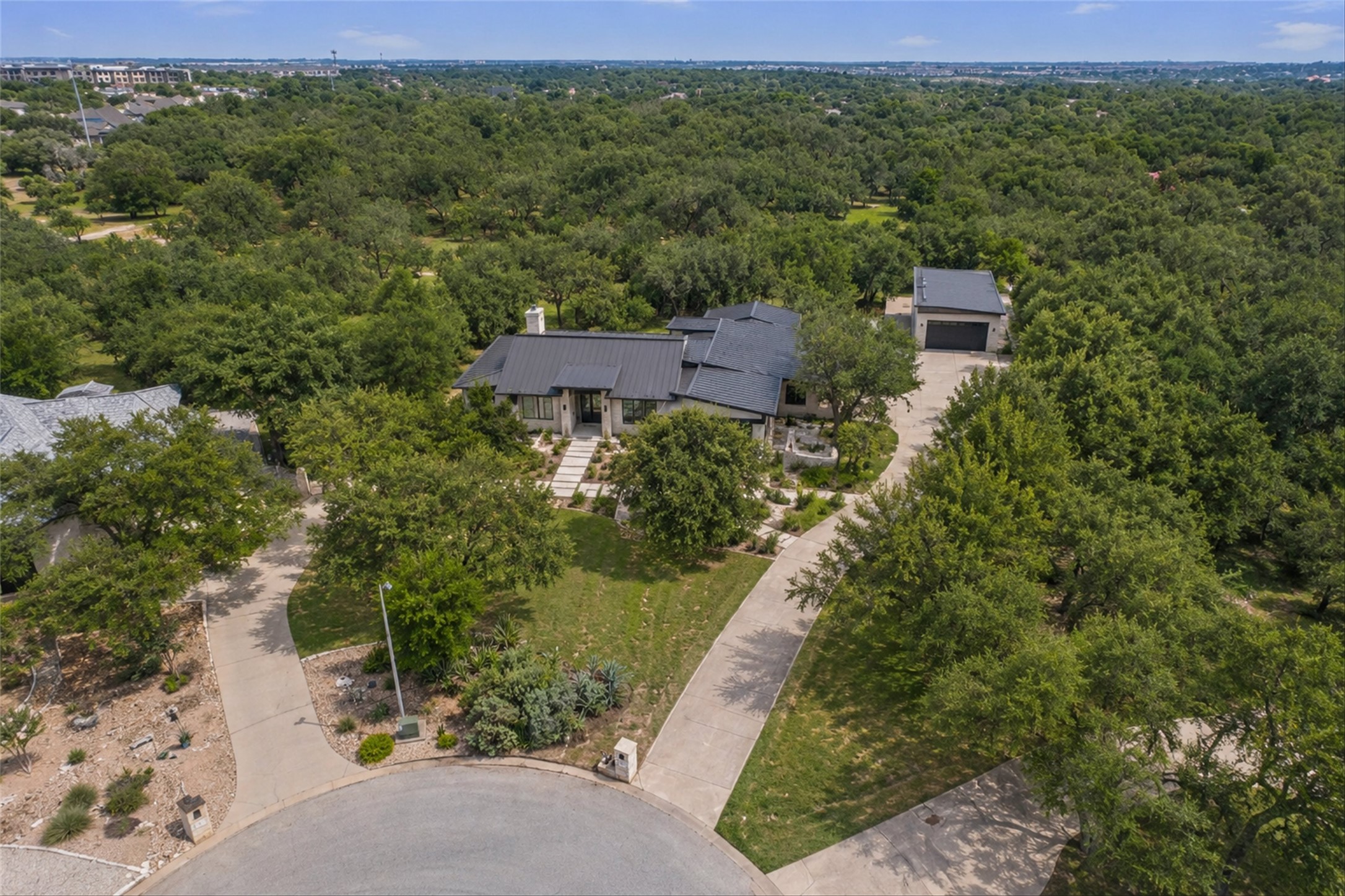 120 East Rustle Cove Georgetown, TX 78628 - Photo 24 of 25 a view of a city with lush green forest