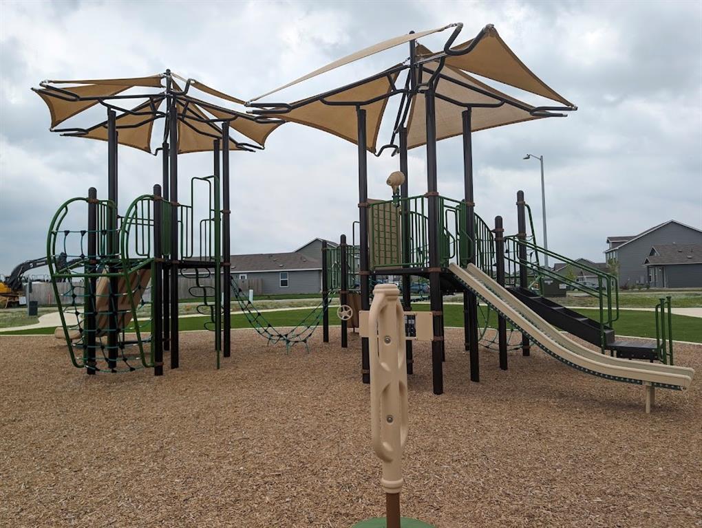 564 Rancho Del Cielo Loop Jarrell, TX 76537 - Photo 11 of 14 Kids of all ages will delight in this community playground's slides and climbing structures.