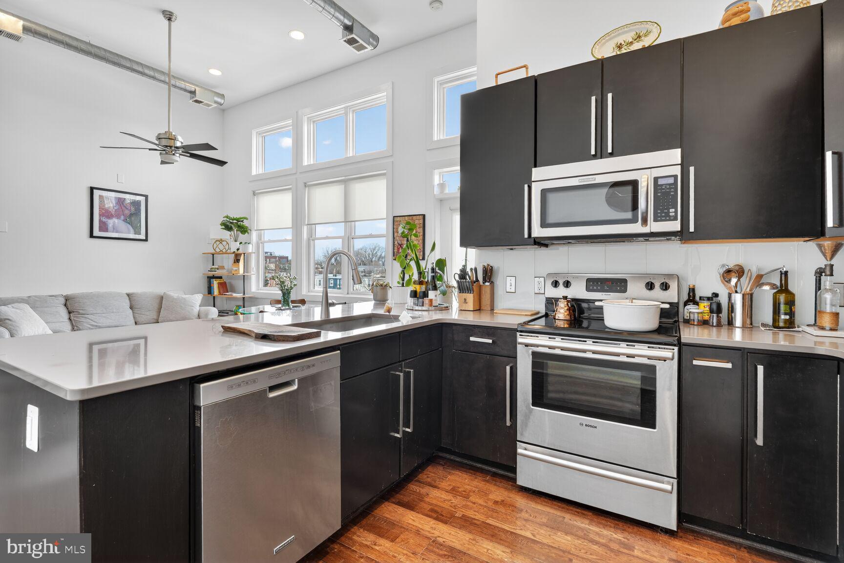 245 15th Street Southeast, Unit 403 Washington, DC 20003 - Photo 4 of 24 Open Kitchen with Stainless Steel Appliances
