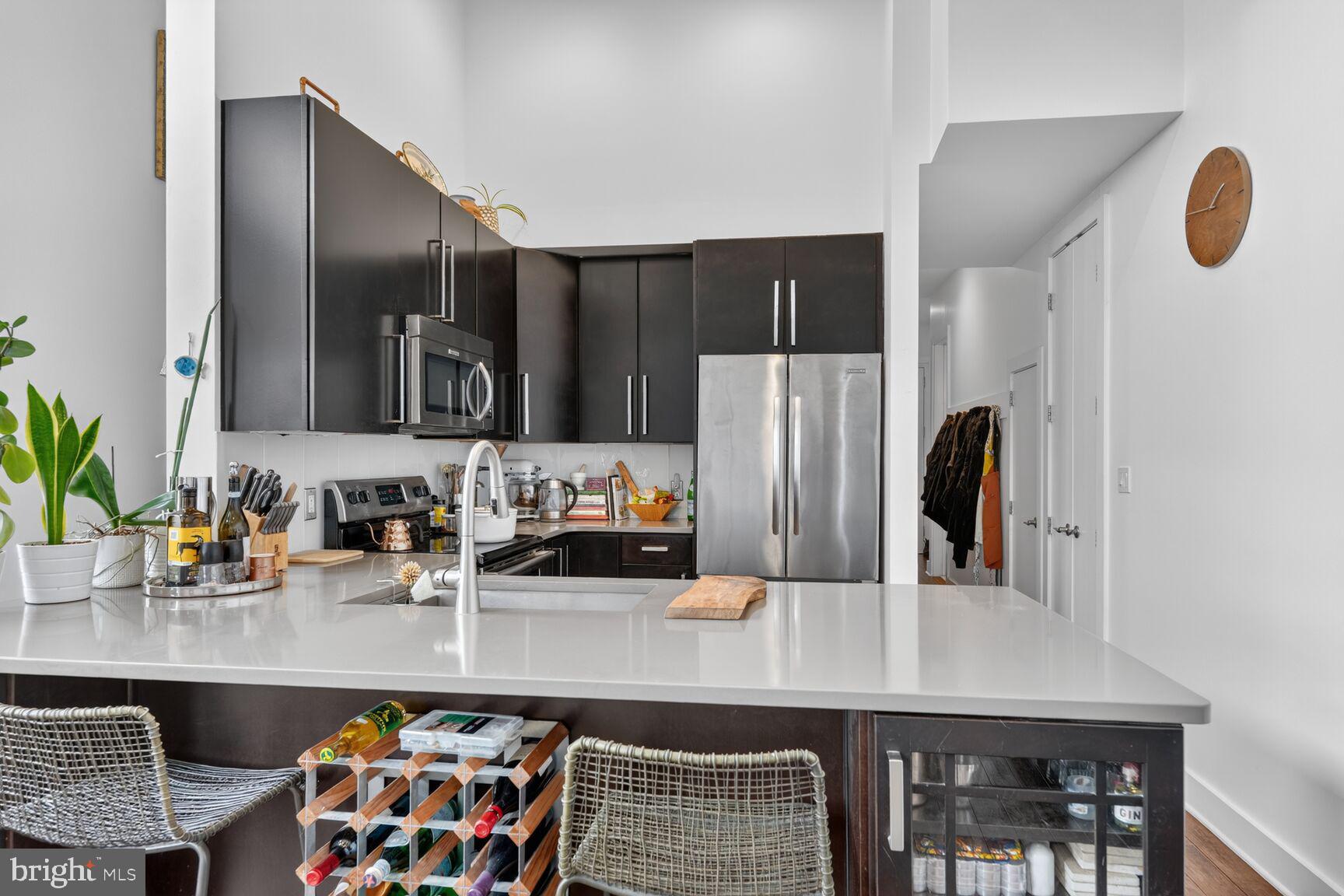 245 15th Street Southeast, Unit 403 Washington, DC 20003 - Photo 6 of 24 Open Kitchen with Stainless Steel Appliances