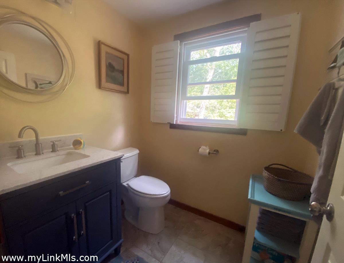 8 Old Purchase Road Edgartown, MA 02539 - Photo 14 of 26 a bathroom with a toilet sink and mirror