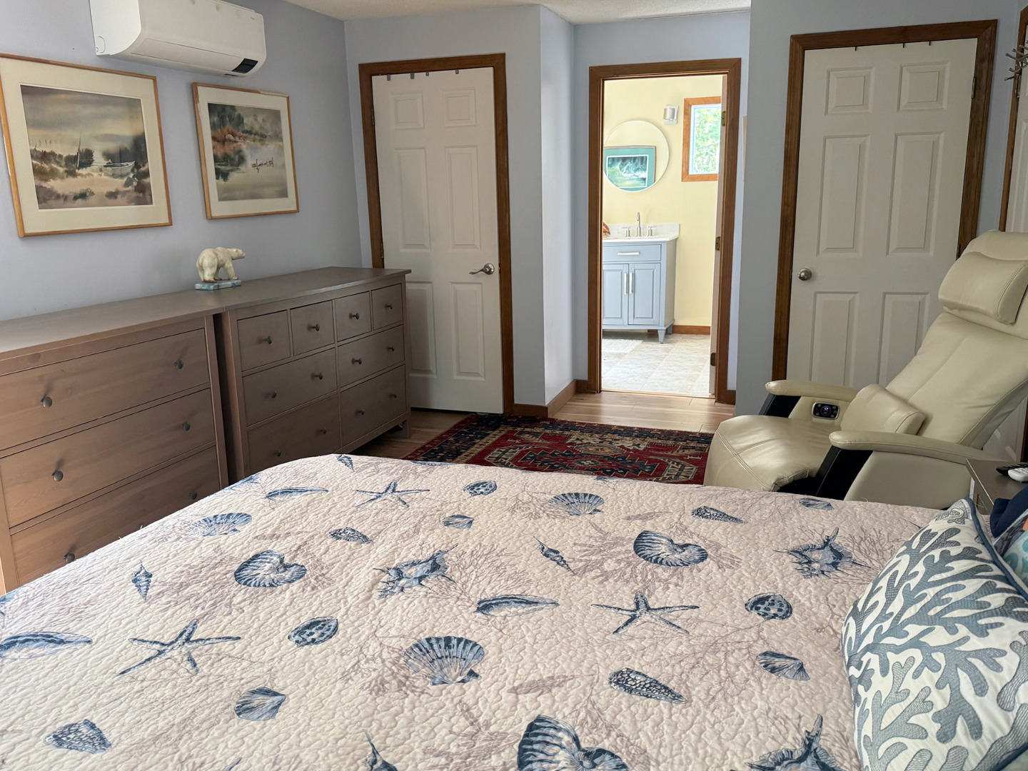 8 Old Purchase Road Edgartown, MA 02539 - Photo 16 of 26 a bedroom with a bed and a chandelier