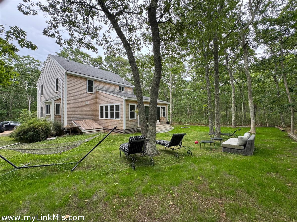 8 Old Purchase Road Edgartown, MA 02539 - Photo 2 of 26 a view of a house with backyard sitting area and garden
