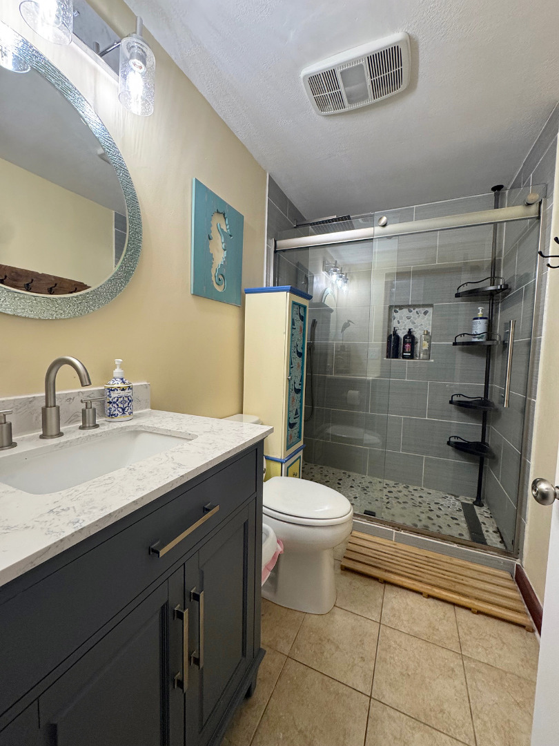 8 Old Purchase Road Edgartown, MA 02539 - Photo 21 of 26 a bathroom with a sink toilet and shower