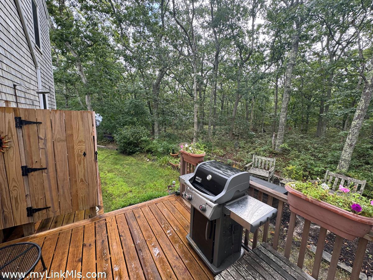 8 Old Purchase Road Edgartown, MA 02539 - Photo 24 of 26 a view of a chairs and table on the wooden deck
