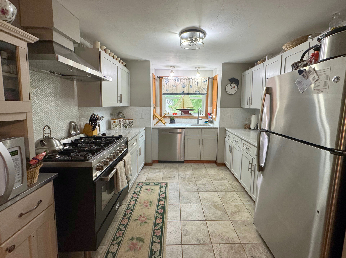 8 Old Purchase Road Edgartown, MA 02539 - Photo 9 of 26 a kitchen with stainless steel appliances granite countertop a stove a refrigerator and a sink