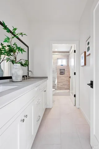 a bathroom with sink and mirror