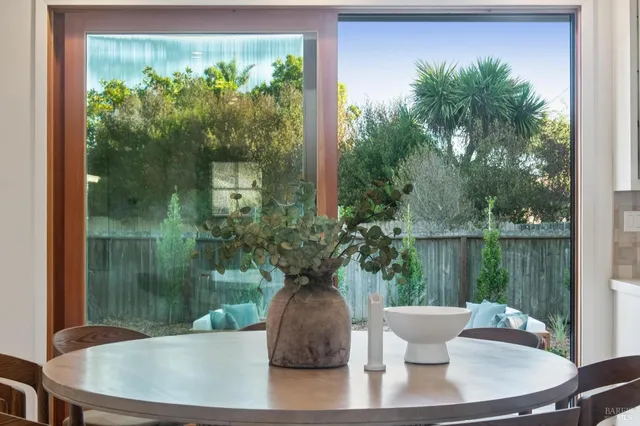a view of a dining room with furniture window and outside view