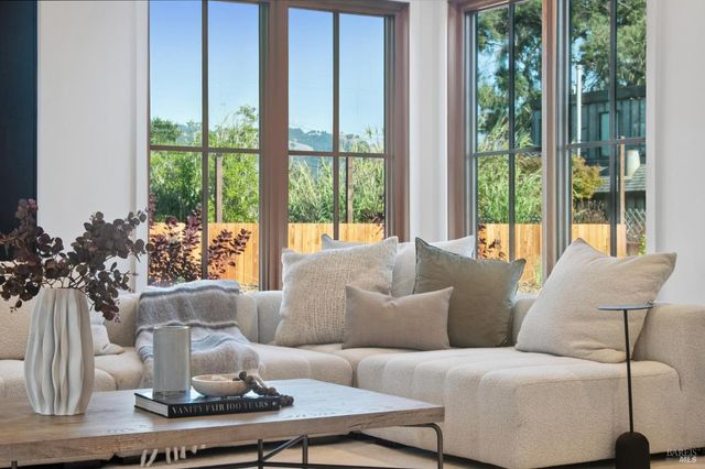 a living room with furniture and a table