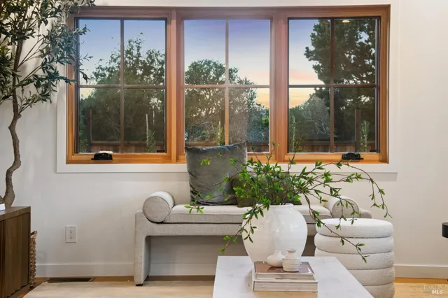 a dining room with furniture and window
