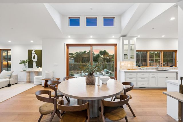 a large bedroom with bed and large window