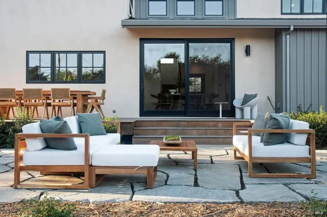 a outdoor living area with furniture and a potted plant