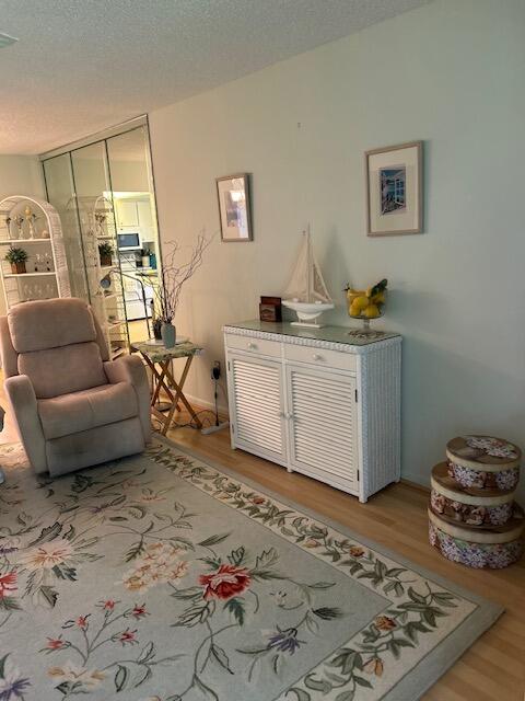 1955 Southwest Palm City Road, Unit H Stuart, FL 34994 - Photo 11 of 22 a living room with furniture and a rug
