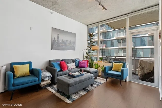 a living room with furniture and a rug