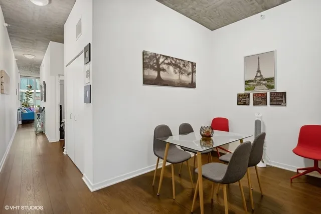 a view of a dining room with furniture and wooden floor