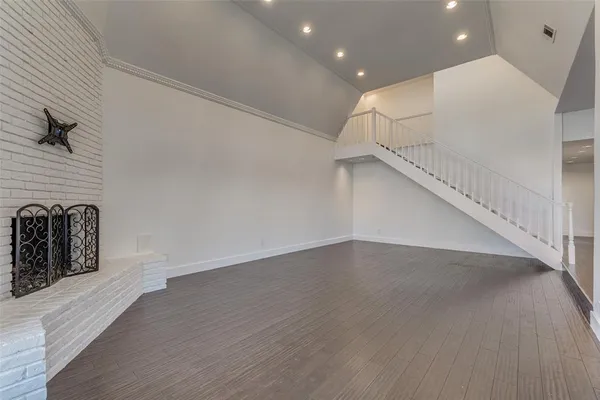 a view of a livingroom with wooden floor
