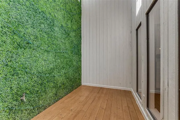 a view of a backyard from a balcony