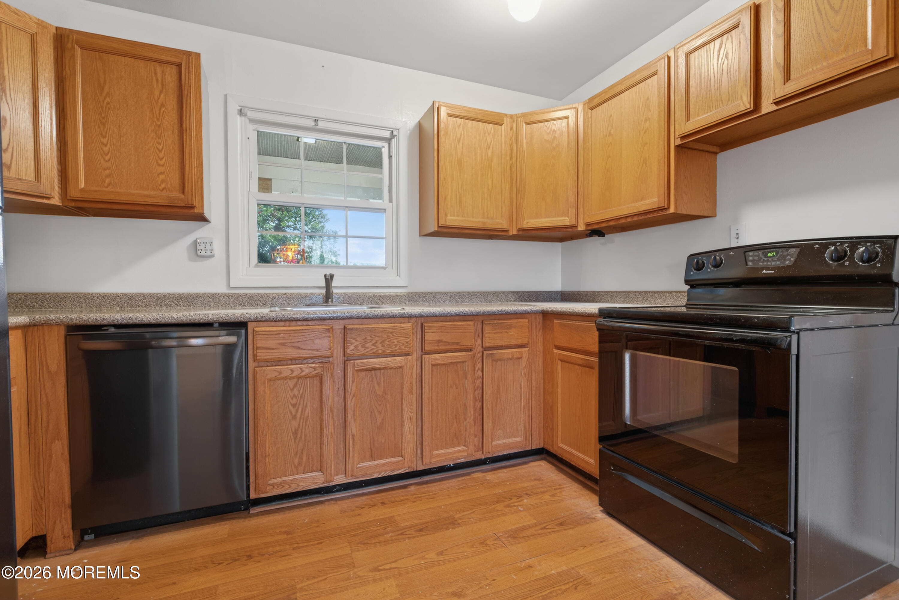 120 Andover Lane Matawan, NJ 07747 - Photo 11 of 35 a kitchen with granite countertop cabinets stainless steel appliances and a sink