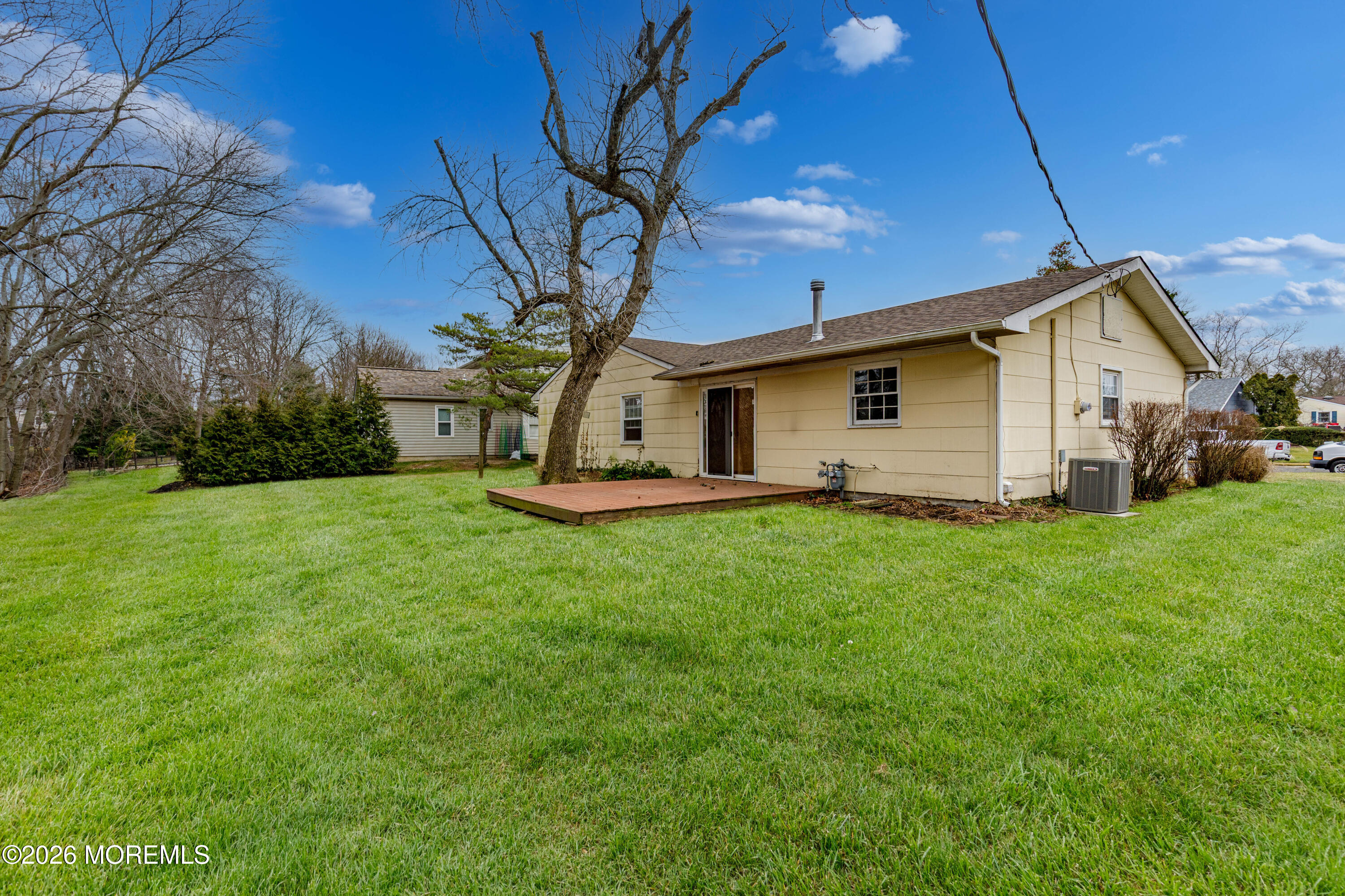 120 Andover Lane Matawan, NJ 07747 - Photo 12 of 35 a view of a white house with a big yard