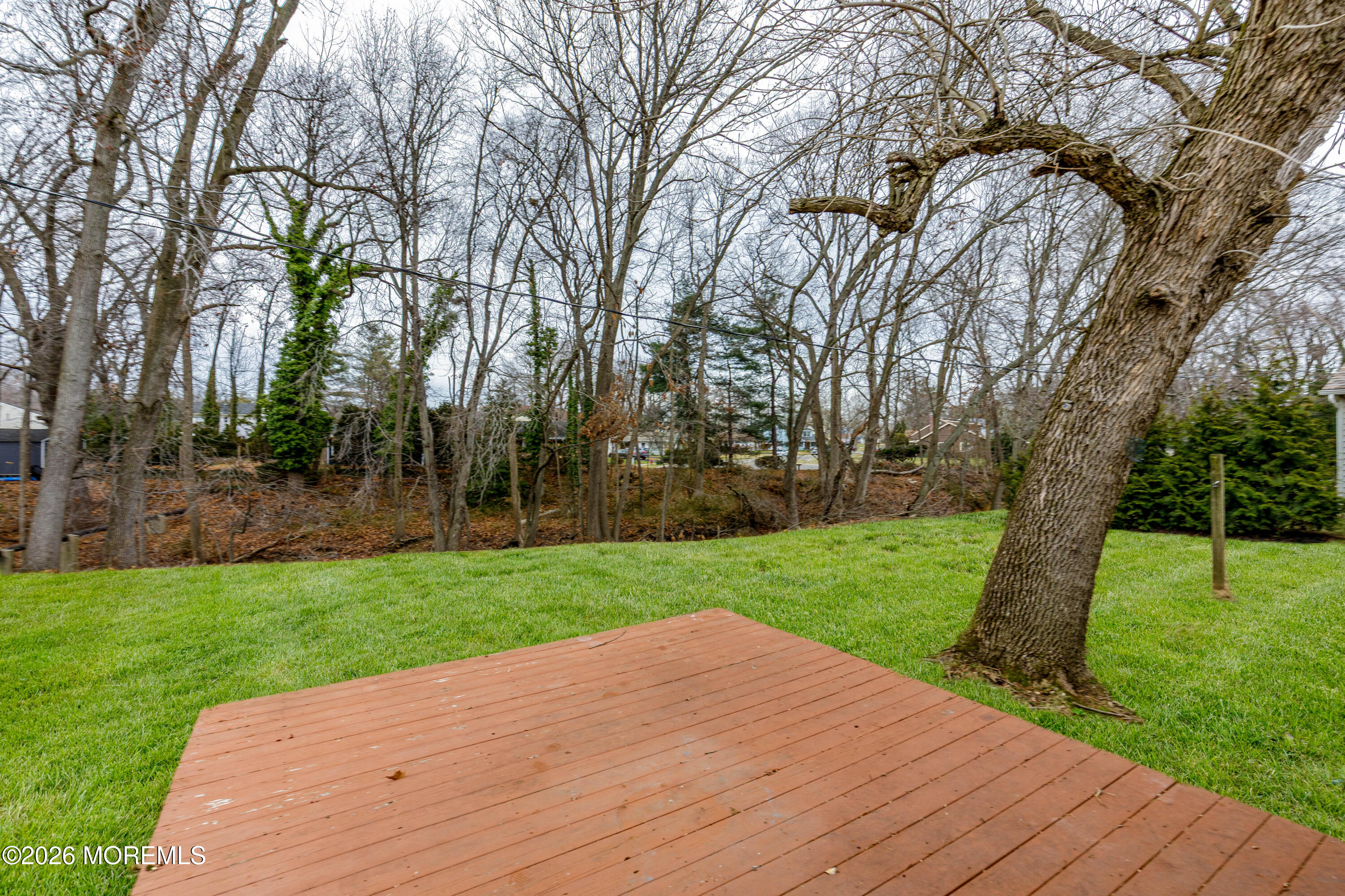 120 Andover Lane Matawan, NJ 07747 - Photo 13 of 35 a view of a backyard with green space