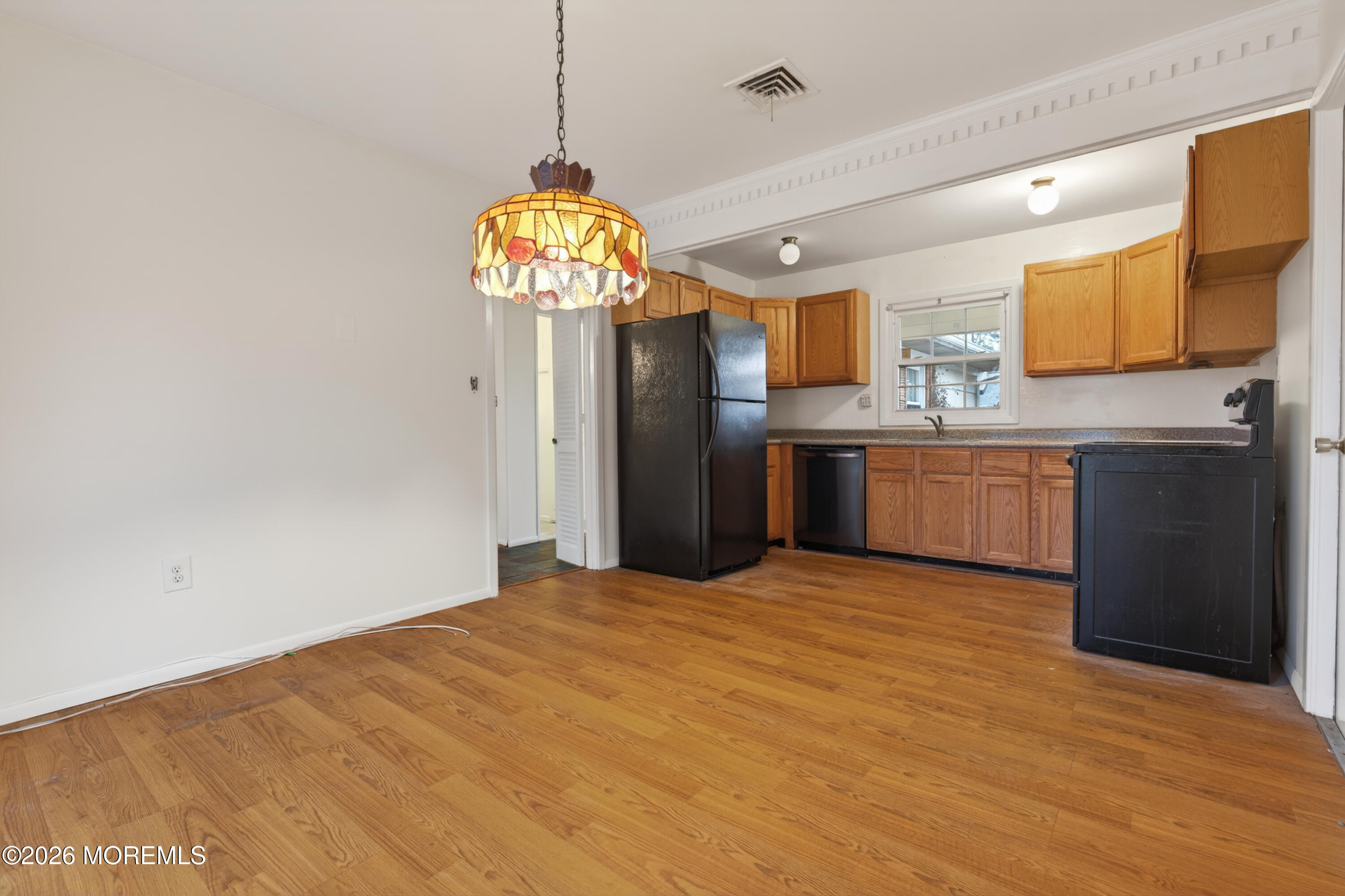 120 Andover Lane Matawan, NJ 07747 - Photo 25 of 35 a view of a kitchen with a sink stainless steel appliances and cabinets