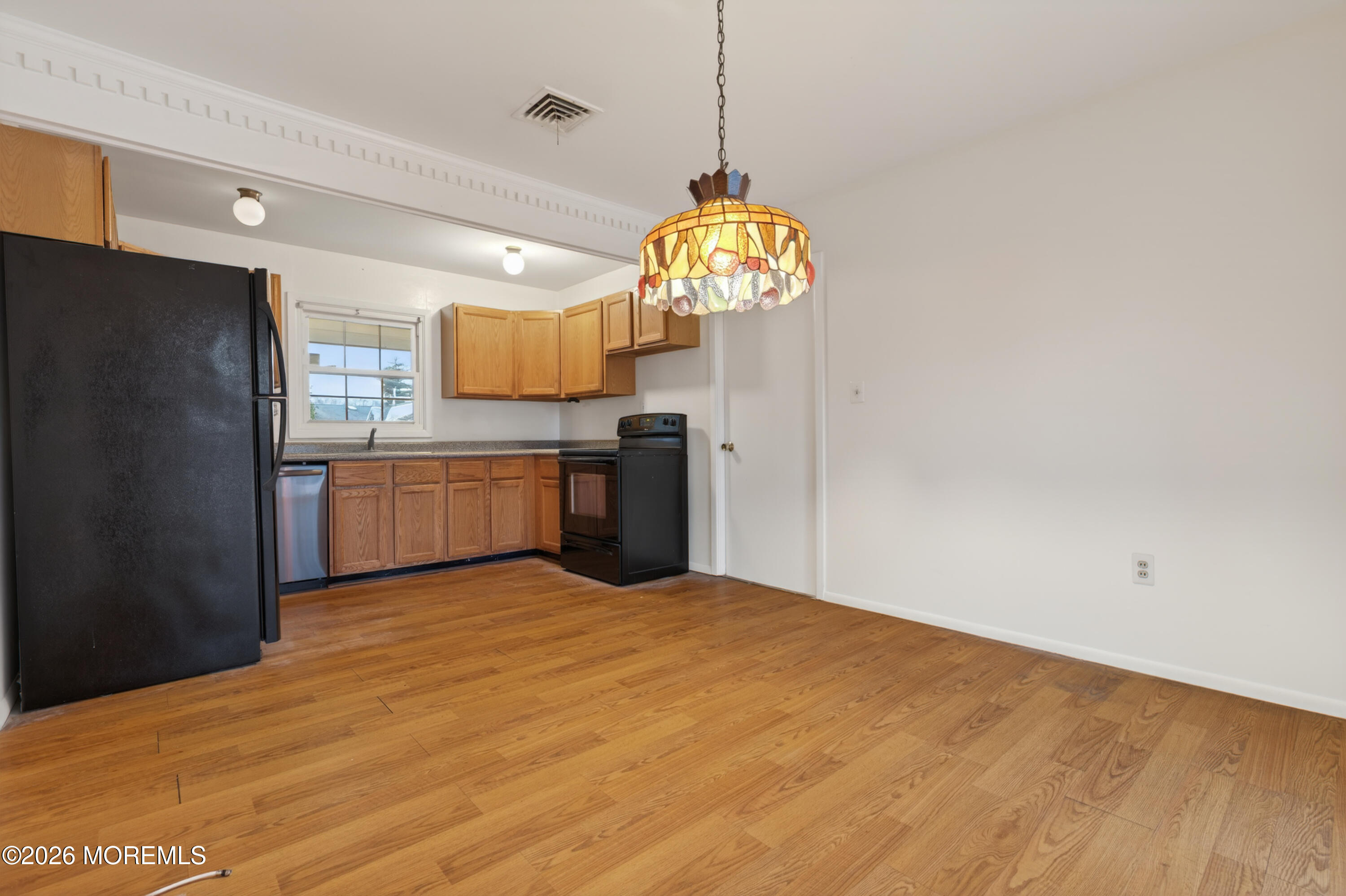 120 Andover Lane Matawan, NJ 07747 - Photo 26 of 35 a view of a kitchen with a refrigerator and a stove top oven