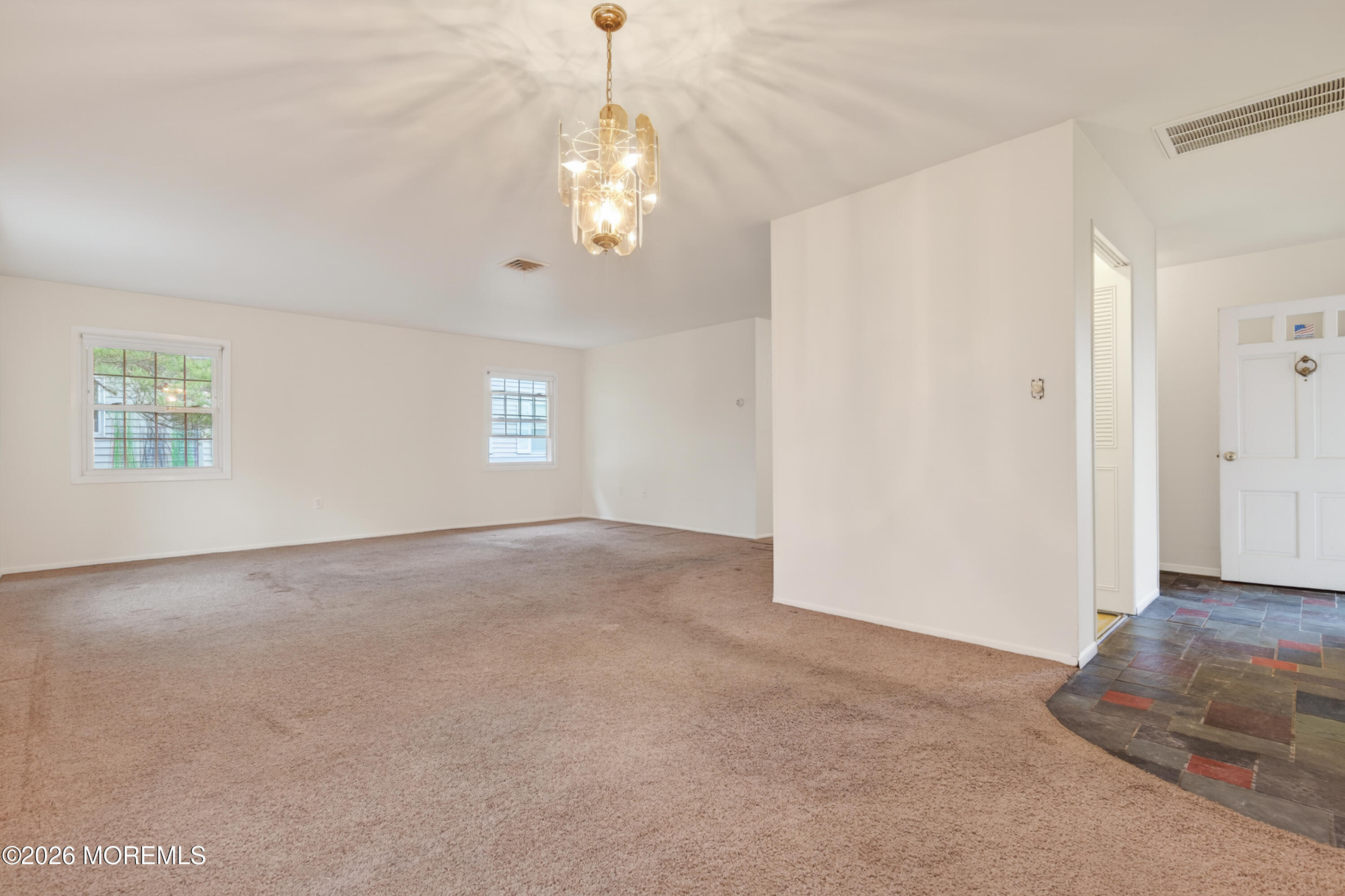 120 Andover Lane Matawan, NJ 07747 - Photo 7 of 35 en empty room with windows and ceiling fan