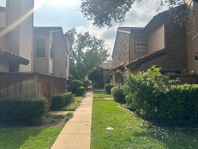 5626 Preston Oaks Road, Unit 5D Dallas, TX 75254 - Photo 26 of 29 a view of a back yard of the house