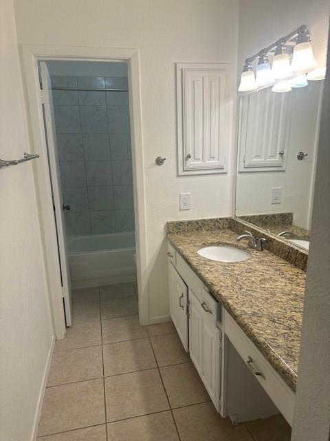 5626 Preston Oaks Road, Unit 5D Dallas, TX 75254 - Photo 9 of 29 a bathroom with a granite countertop sink and a mirror