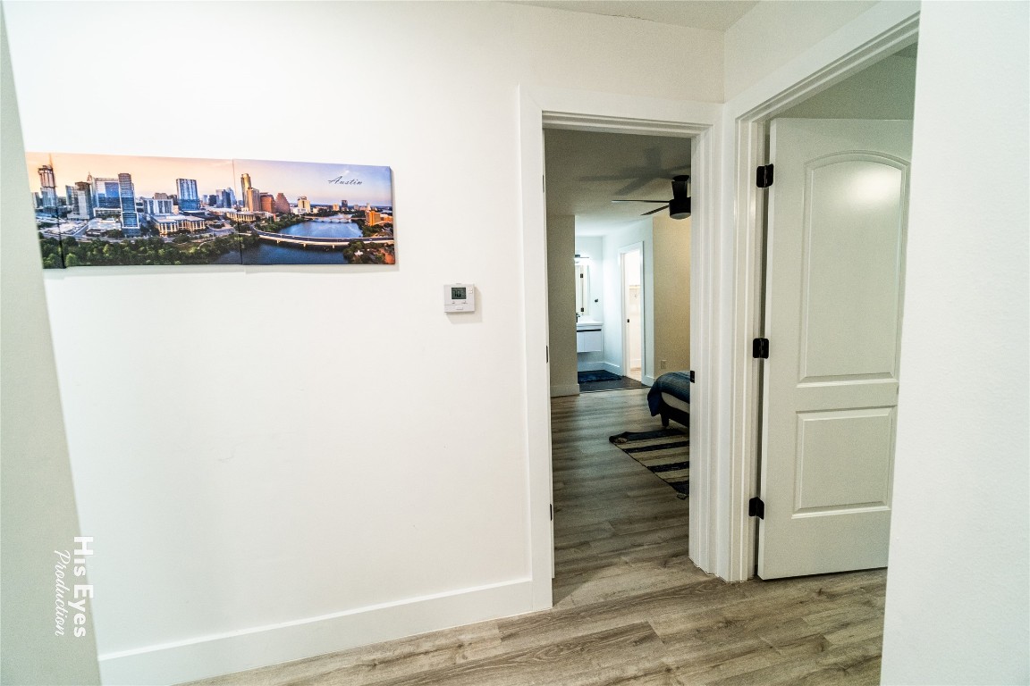 7500 Rio Pass Austin, TX 78724 - Photo 11 of 38 wooden floor in a hallway with a room