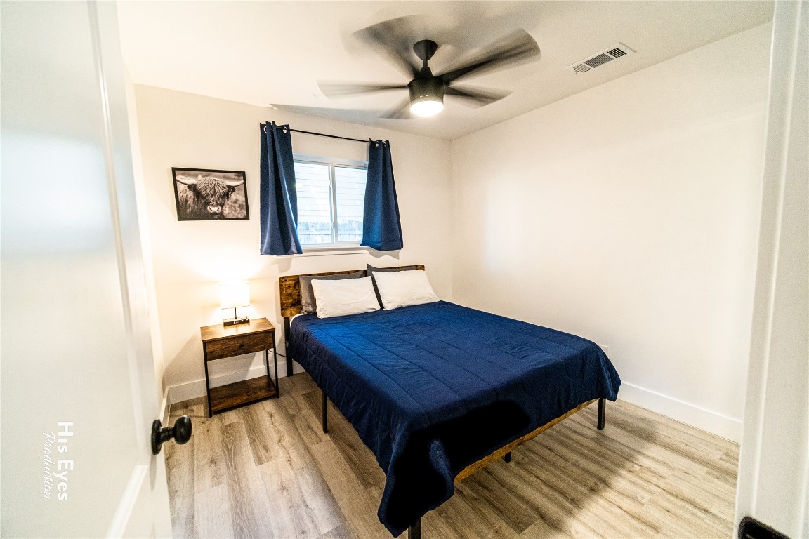7500 Rio Pass Austin, TX 78724 - Photo 12 of 38 a bedroom with a bed and a desk