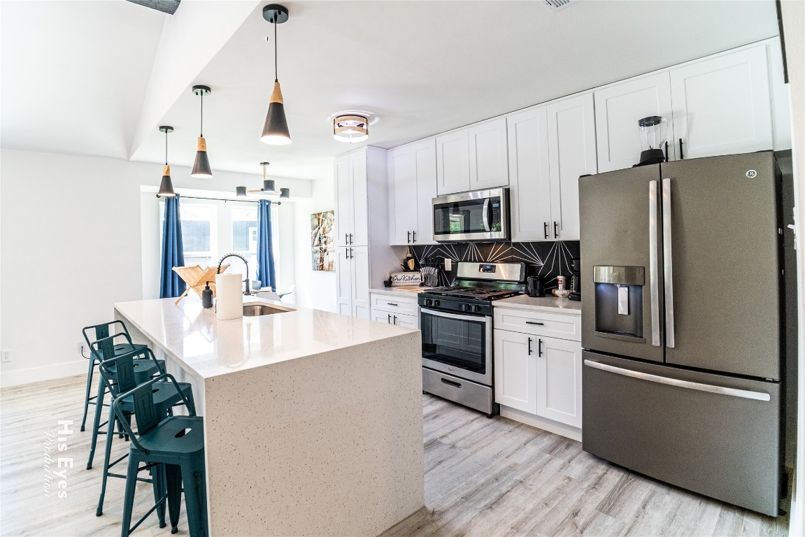 7500 Rio Pass Austin, TX 78724 - Photo 18 of 38 a kitchen with stainless steel appliances a refrigerator sink and microwave