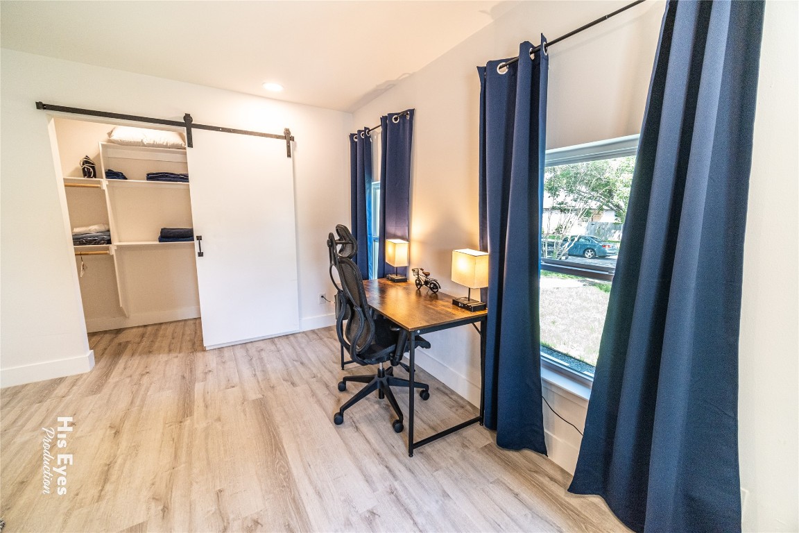 7500 Rio Pass Austin, TX 78724 - Photo 6 of 38 a view of a room with wooden floor and wardrobe
