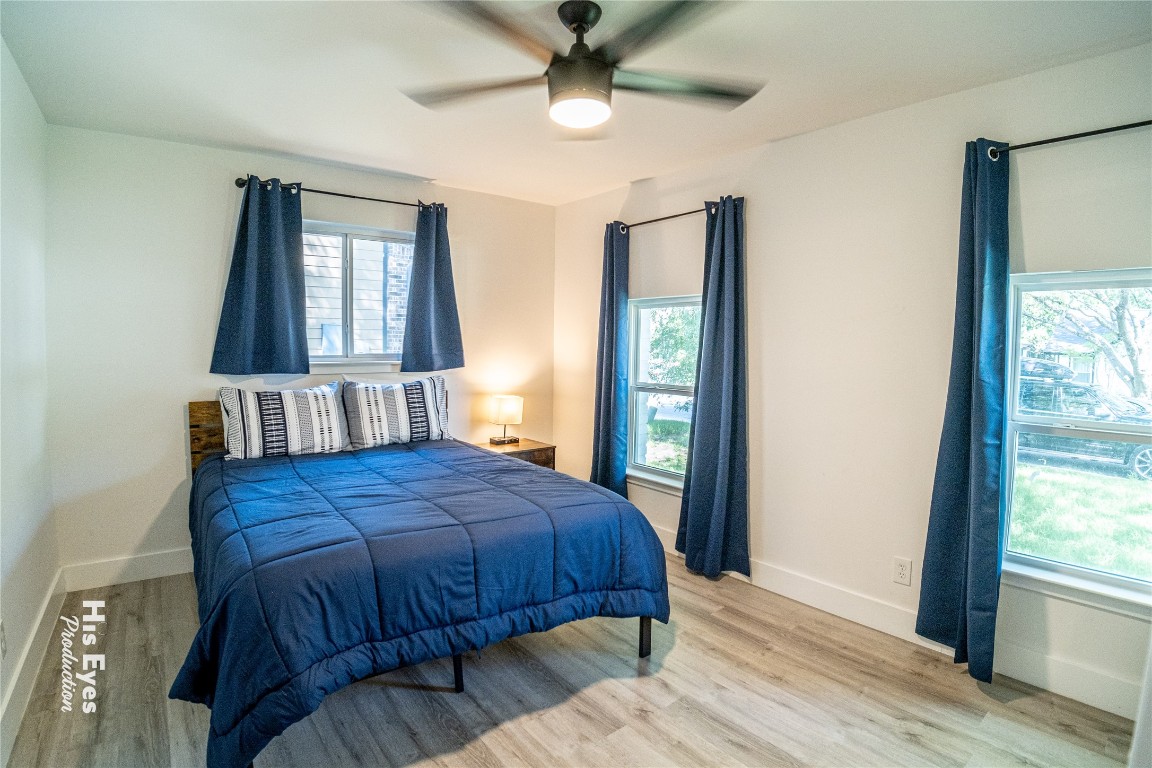 7500 Rio Pass Austin, TX 78724 - Photo 9 of 38 a bedroom with a bed windows and dresser