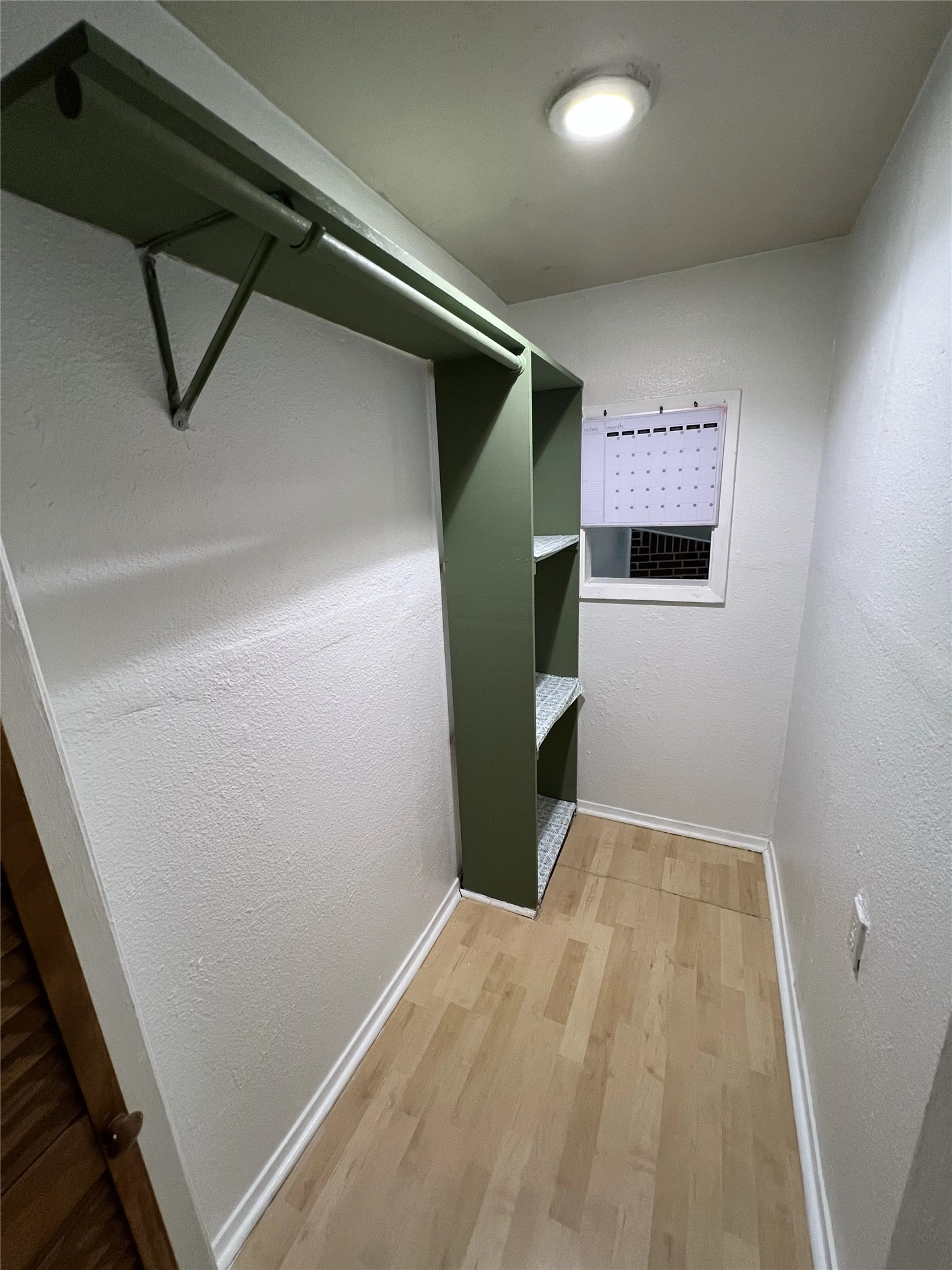 2500 Burleson Road, Unit 622 Austin, TX 78741 - Photo 13 of 17 A well-lit walk-in closet featuring organized shelving and durable flooring.
