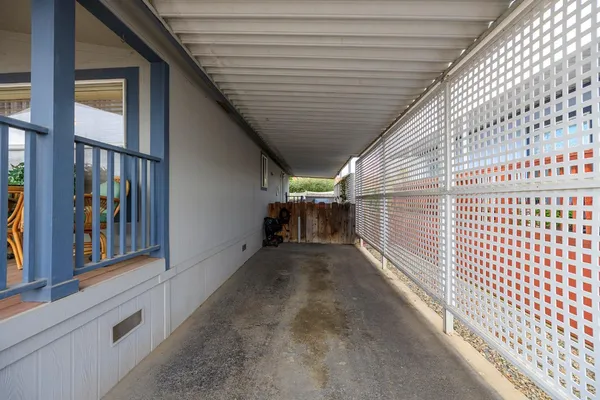 a view of a porch with wooden fence