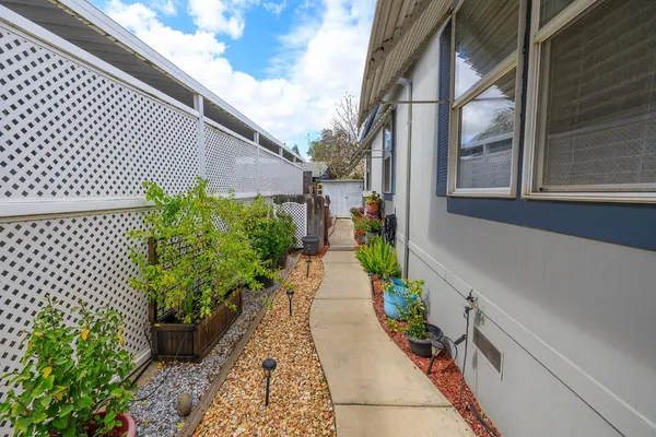 a swimming pool with outdoor seating and city view
