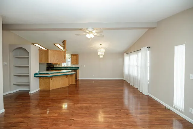 a view of kitchen with refrigerator and stove