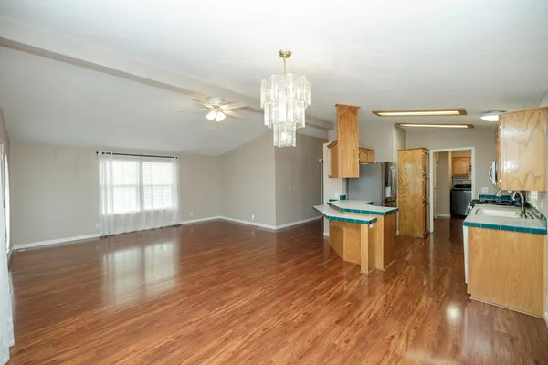 a view of a kitchen and dining room